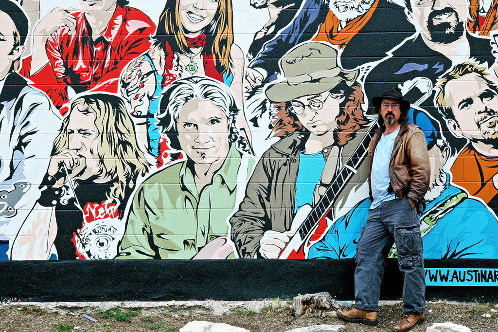 "James McMurtry & Friends" ~ Musician James McMurtry stands next to his image in a mural by Aaron Sacco in Austin, TX. Photo by Ann Woodall