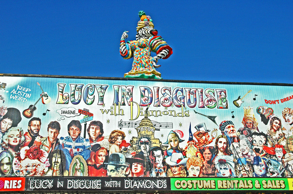 "Lucy In Disguise" ~ The sign for Lucy In Disguise costume shop in Austin, TX with the Carmen Miranda zebra woman on top. Photo by Ann Woodall