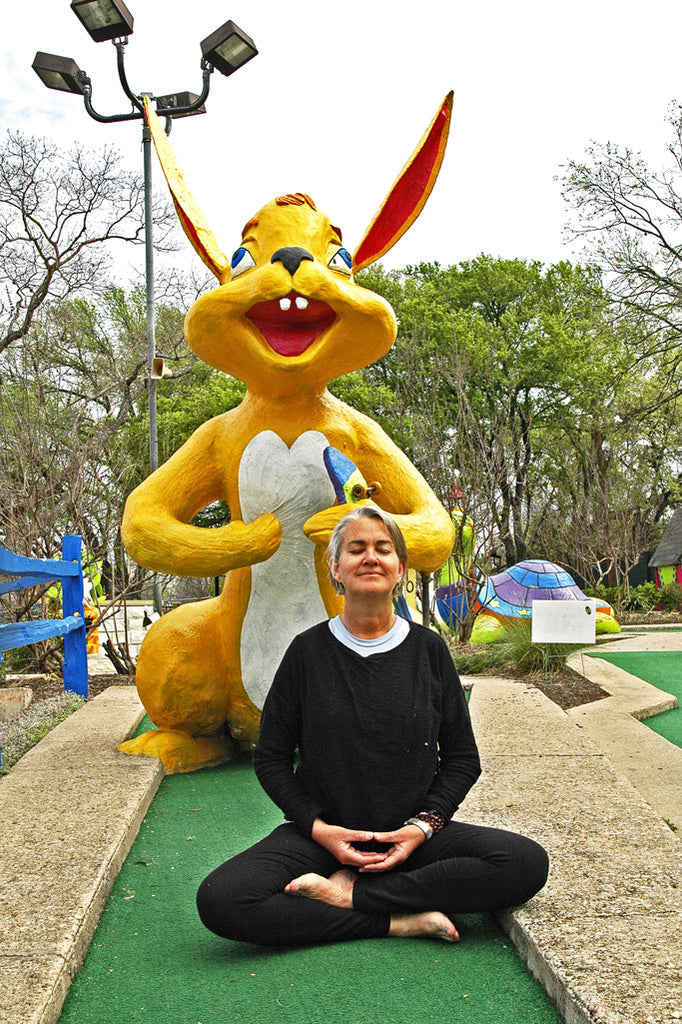 "Yoga Bunnies" ~ Spike Gillespie meditates with giant rabbit in Austin, TX. Photo by Ann Woodall