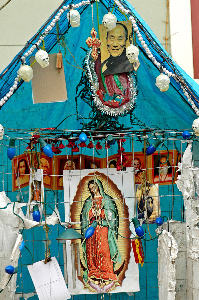 "Dalai Lama" ~ Close-up of a blue makeshift alter to the Dalai Lama and to the Virgin Mary. Photo by Ann Woodall 