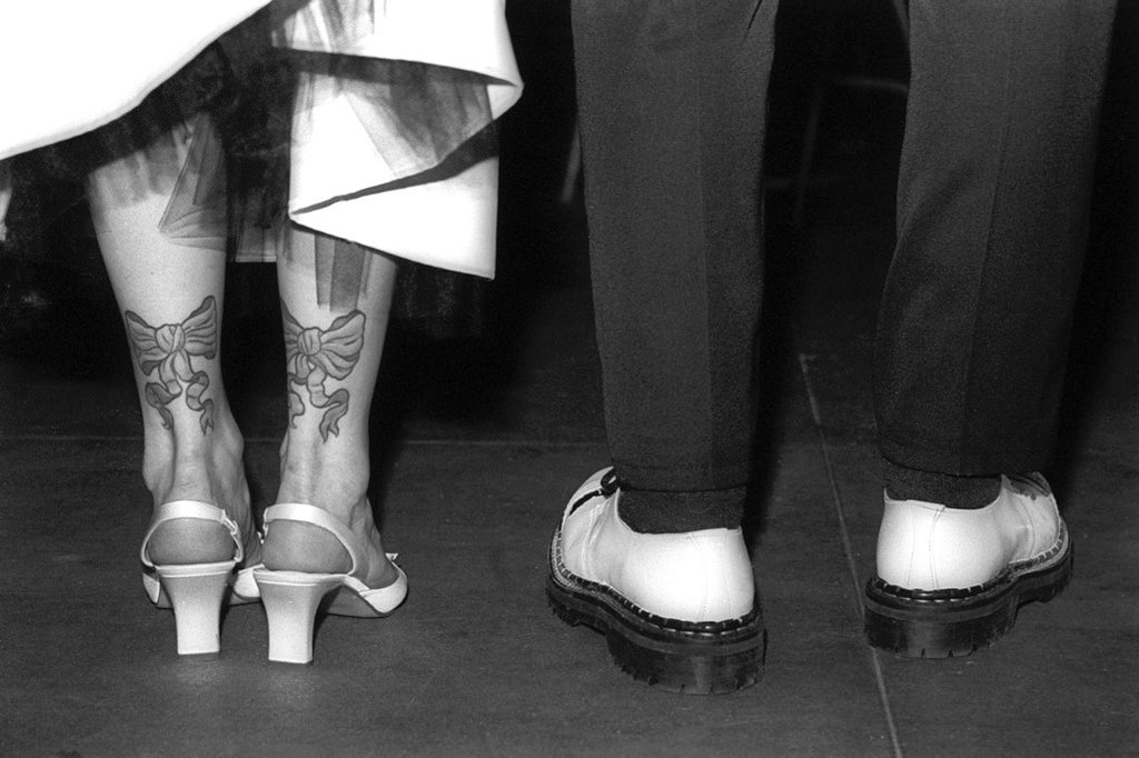 "Just Married" ~ Close-up of legs and shoes of couple getting married. Photo by Ann Woodall