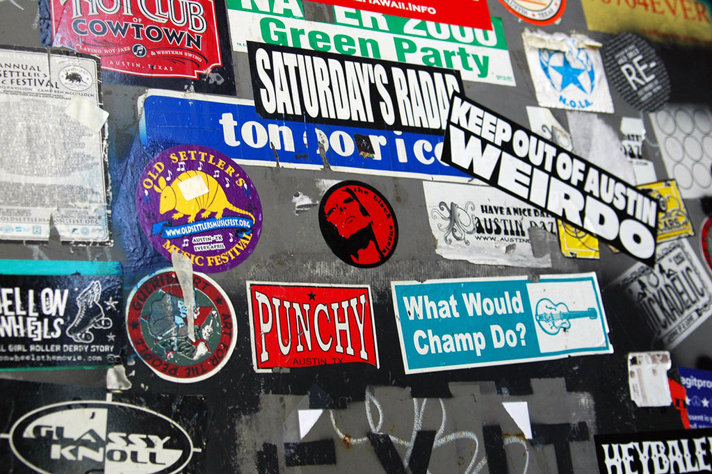 "Punchy" ~ Band stickers cover the back door of the Continental Club in Austin, TX. Photo by Ann Woodall